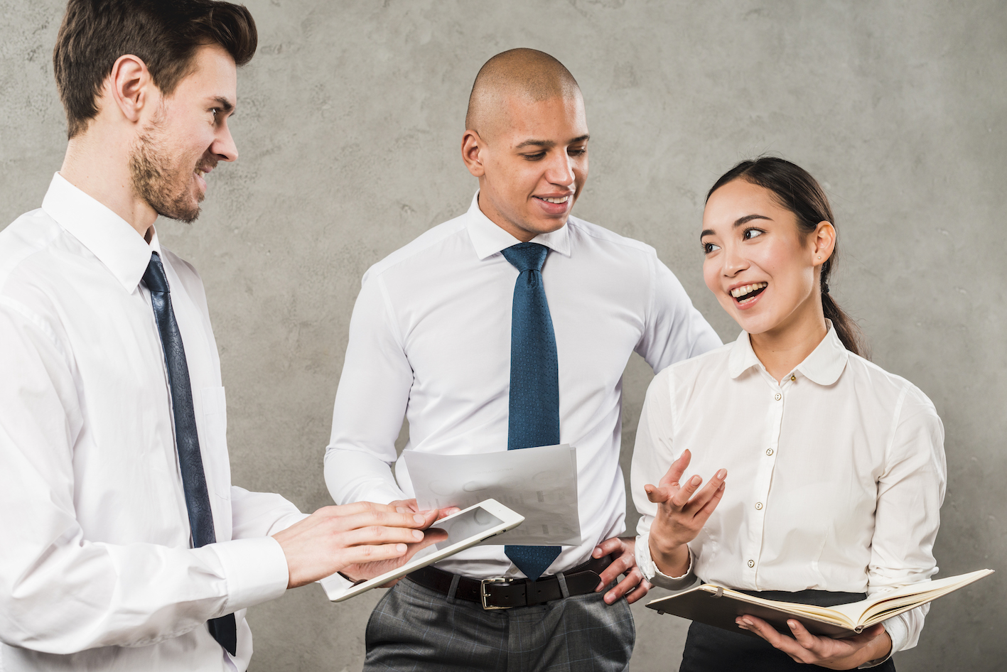 three people having a meeting and laughing