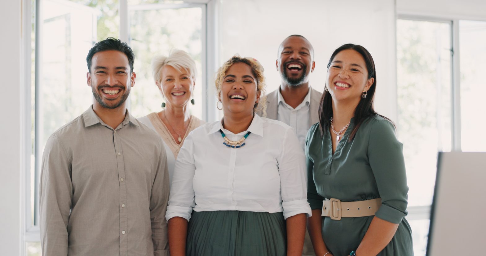 Business team posing for a photograph together in the office