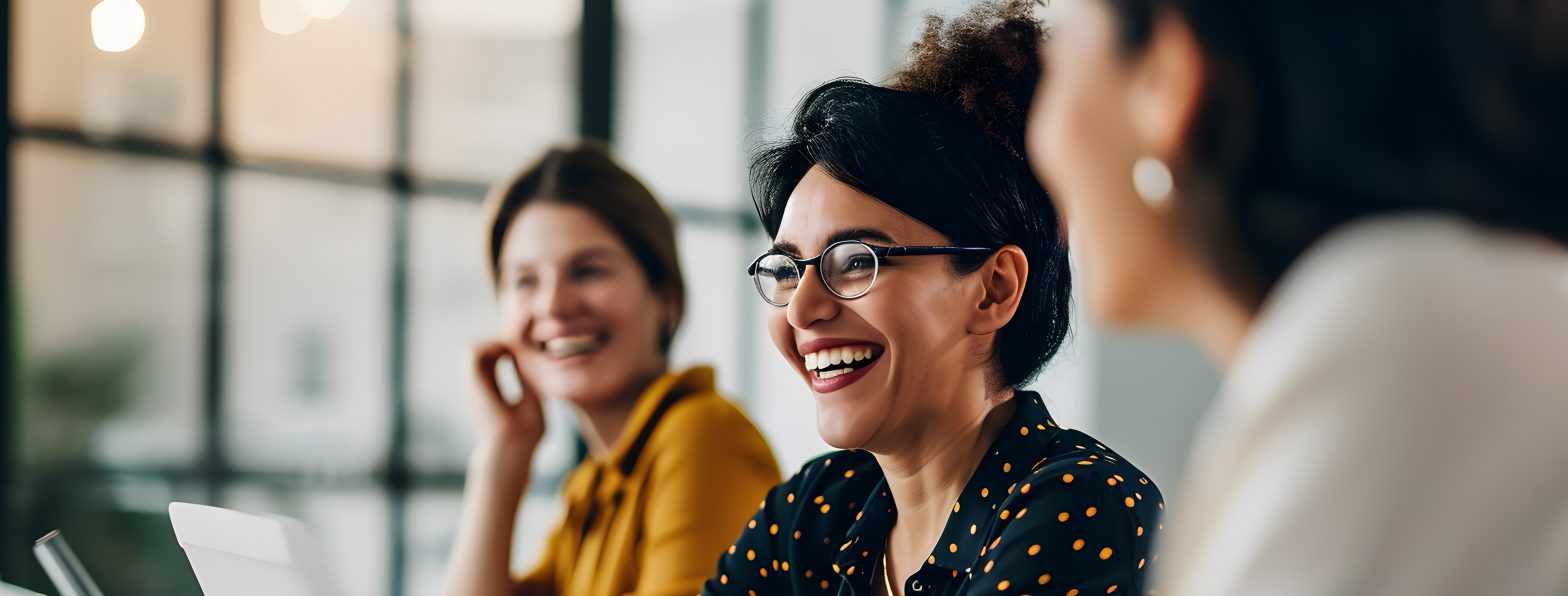 Smiling business women with laptops