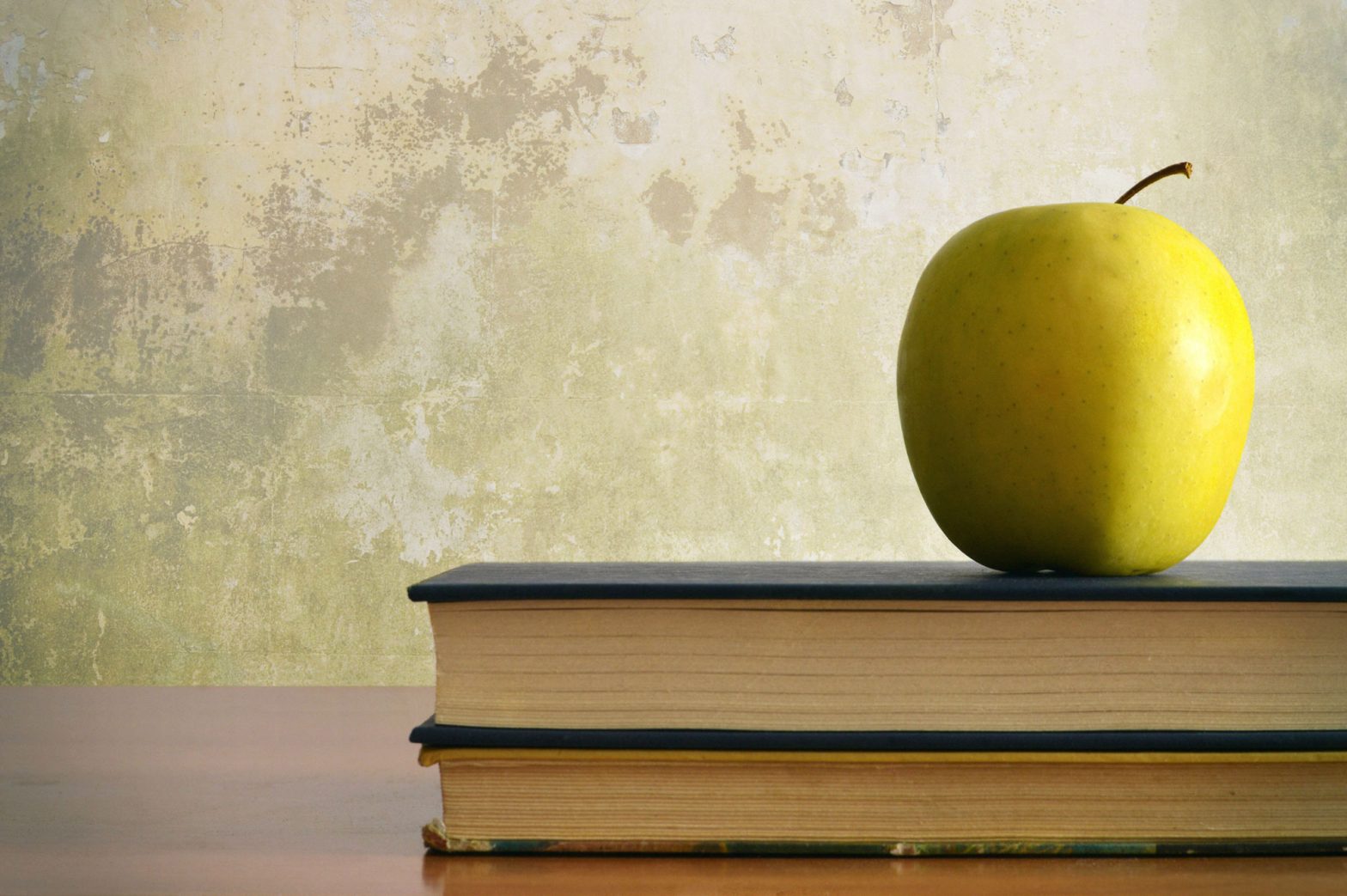 apple on top of books