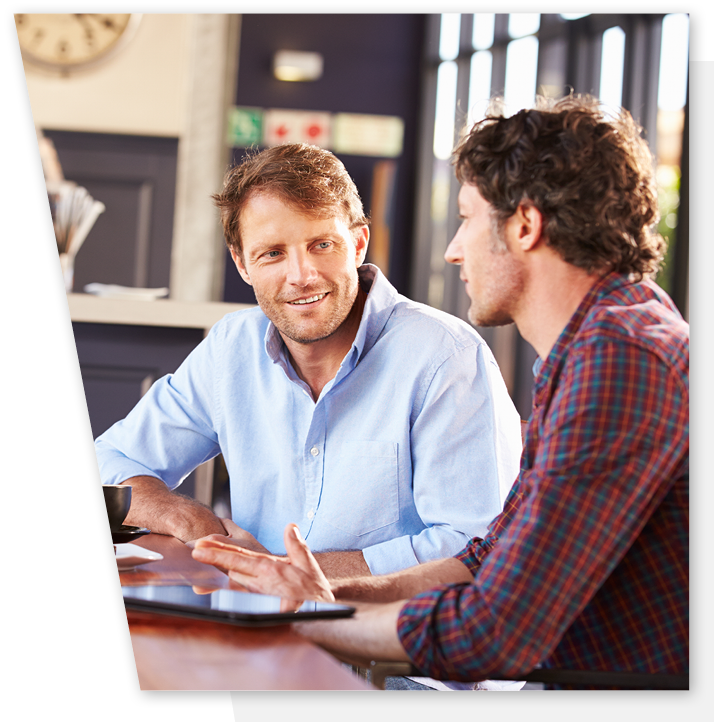 Male Mentor and Mentee in discussion.