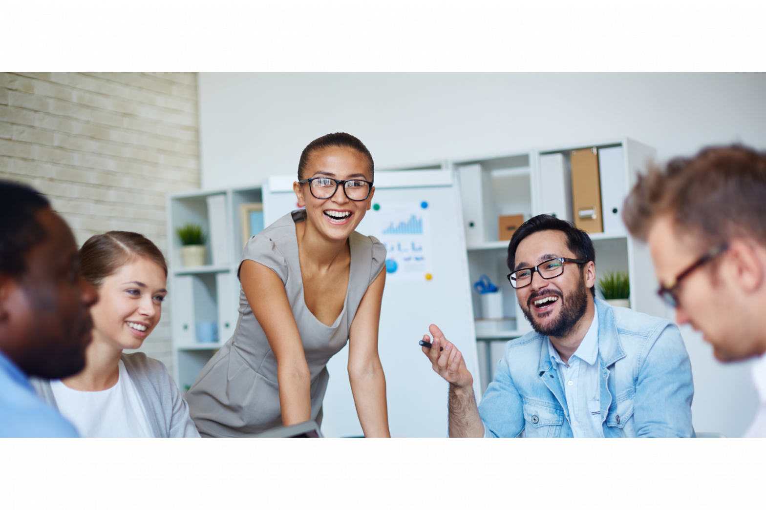 Smiling female professional mentor is in a group discussion